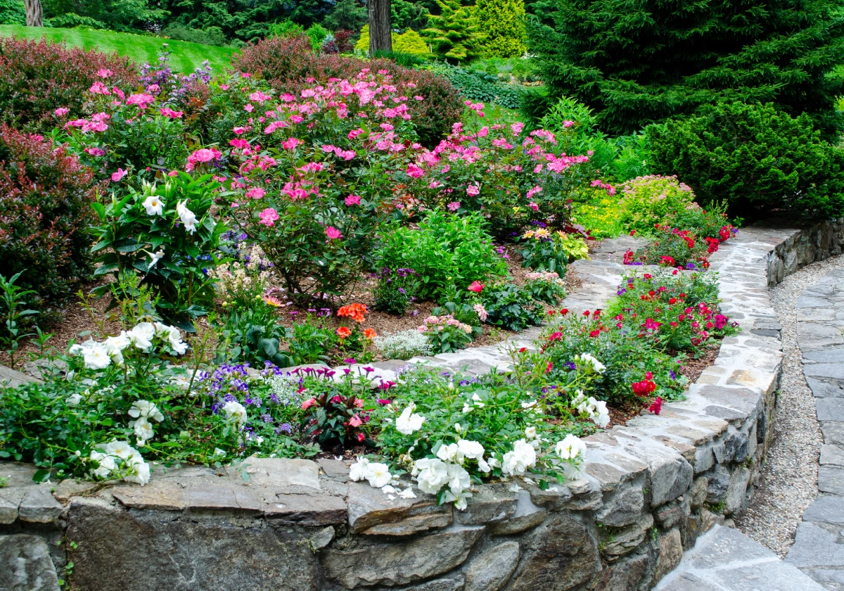 Lush garden with stone retaining wall
